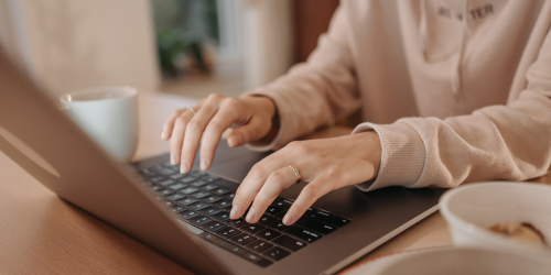 Woman's hands using a laptop
