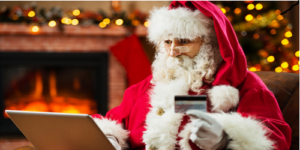 Santa using a bank card to shop online