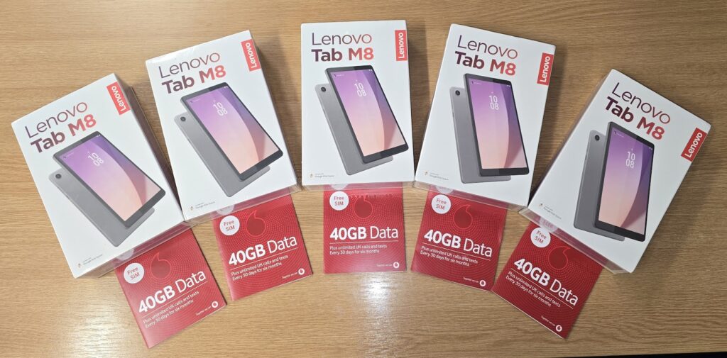 A photo of five Lenovo tablets with five Vodafone sim cards